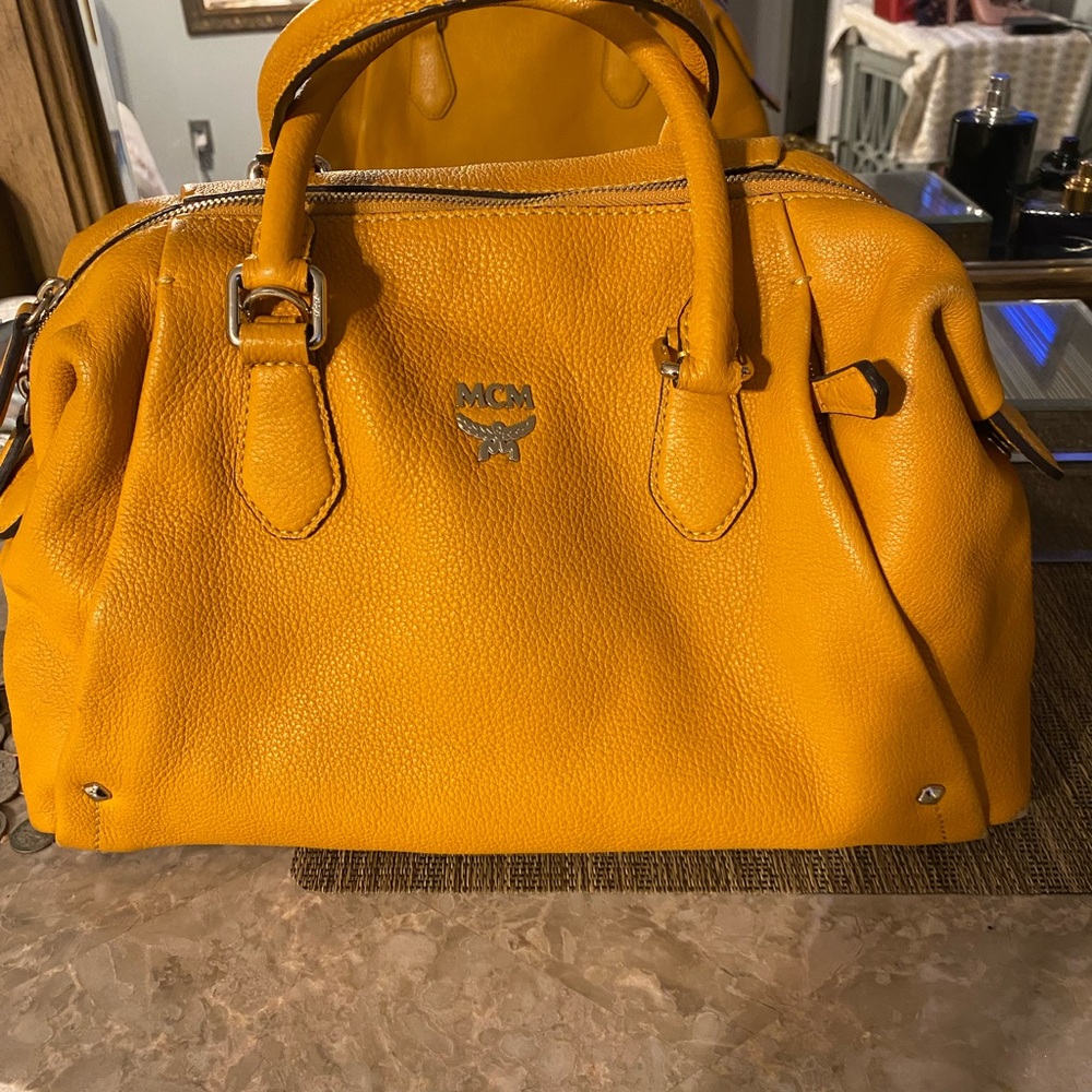 MCM original clean beautiful item. Have not used much no damage at all Appealing